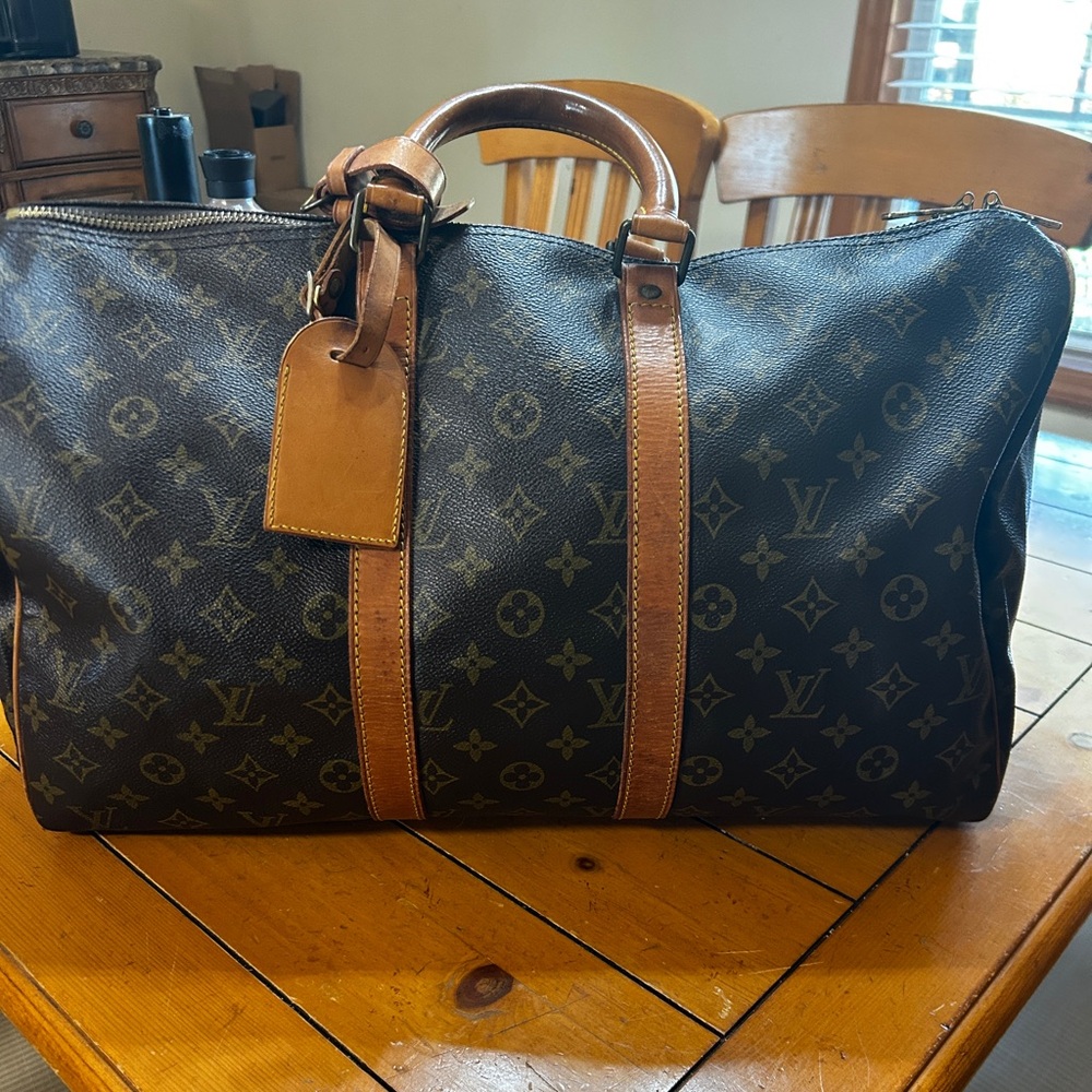 Louis Vuitton Keepall 45 WITH luggage tag.